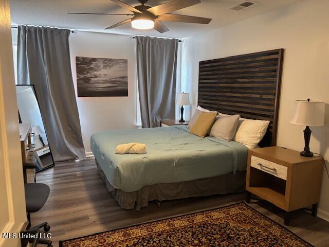 220 Forked Creek Pkwy, Hernando, MS 38632 - bedroom featuring dark wood-style flooring and a ceiling fan
