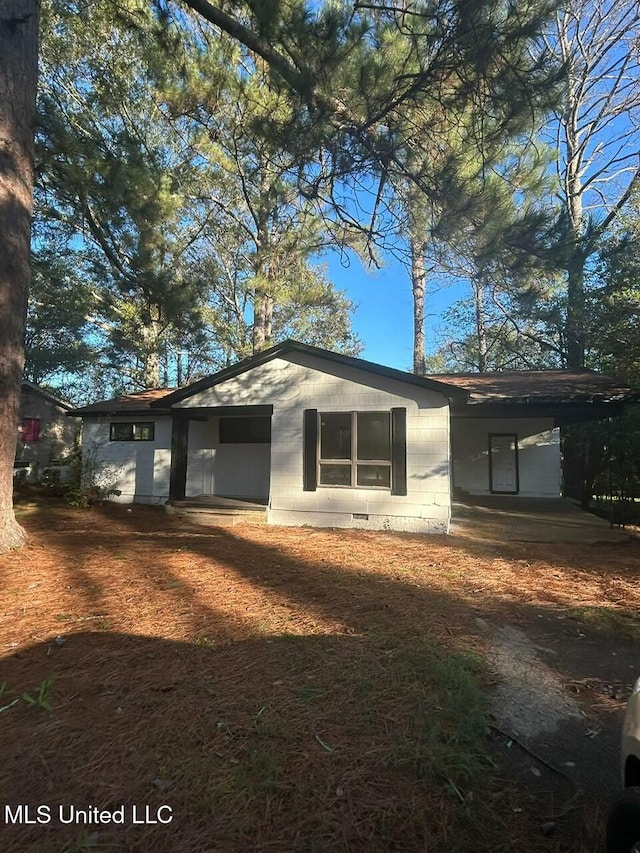 exterior space featuring crawl space and an attached carport