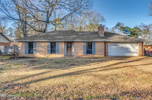 ranch-style home with a garage and a front lawn