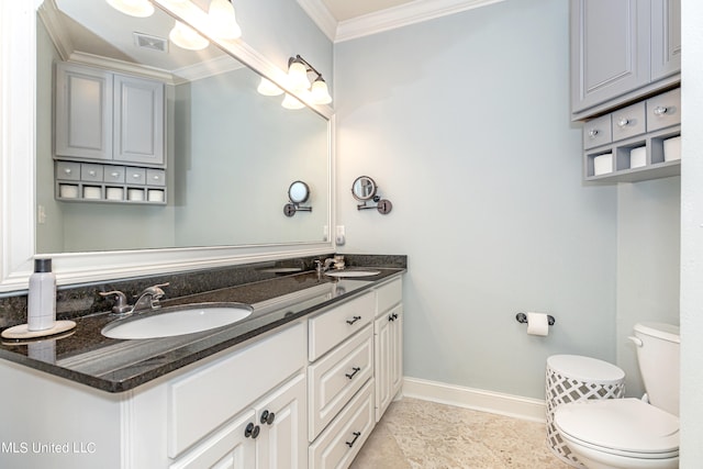 bathroom featuring vanity, toilet, and crown molding