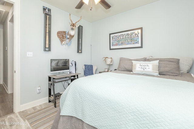 bedroom featuring light hardwood / wood-style floors and ceiling fan