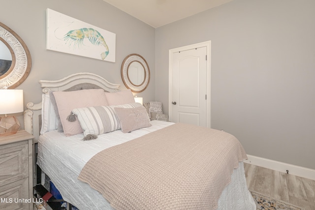 bedroom featuring hardwood / wood-style flooring