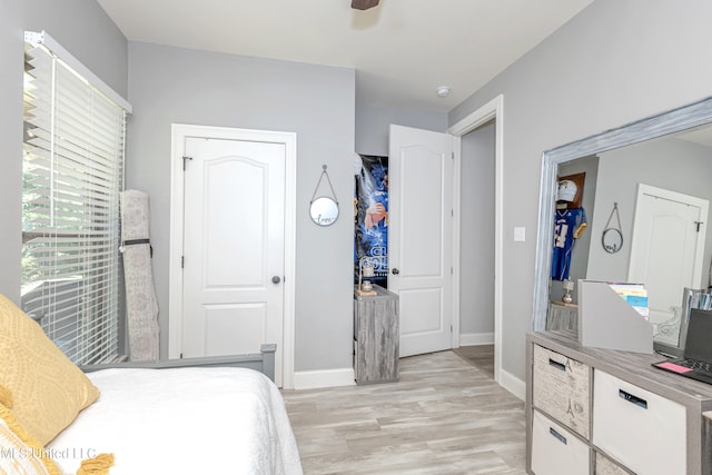 bedroom featuring ceiling fan and light hardwood / wood-style flooring