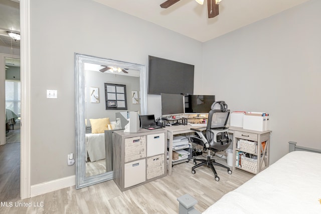 office space featuring light wood-type flooring and ceiling fan