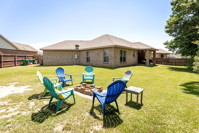 view of yard featuring an outdoor fire pit