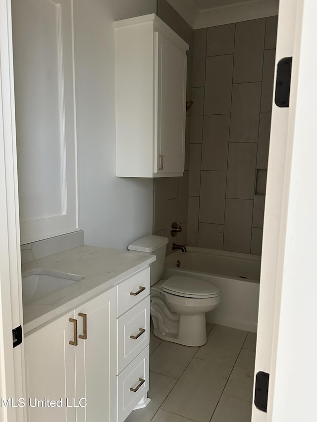 full bathroom with tile patterned floors, vanity, toilet, and tiled shower / bath combo