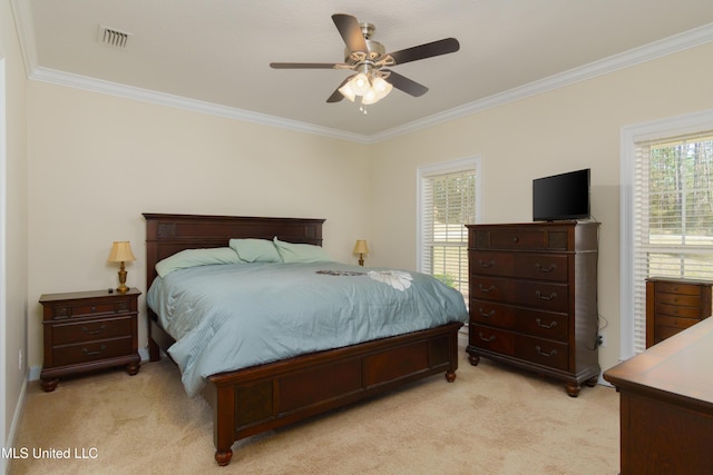 carpeted bedroom featuring multiple windows, ornamental molding, and ceiling fan