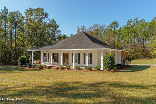 farmhouse-style home with a front lawn and covered porch