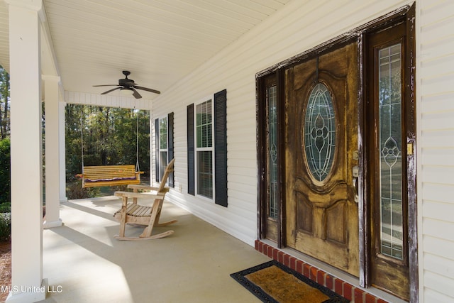 entrance to property featuring ceiling fan