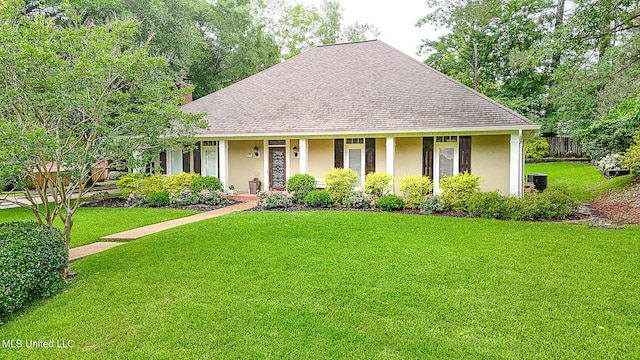 view of front facade featuring stucco siding, a front yard, a shingled roof, a chimney, and a porch