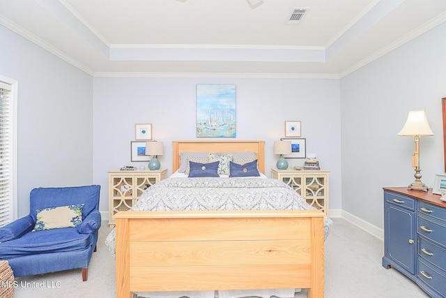 bedroom with light carpet, a raised ceiling, baseboards, and ornamental molding