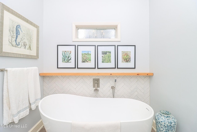full bath featuring a freestanding tub