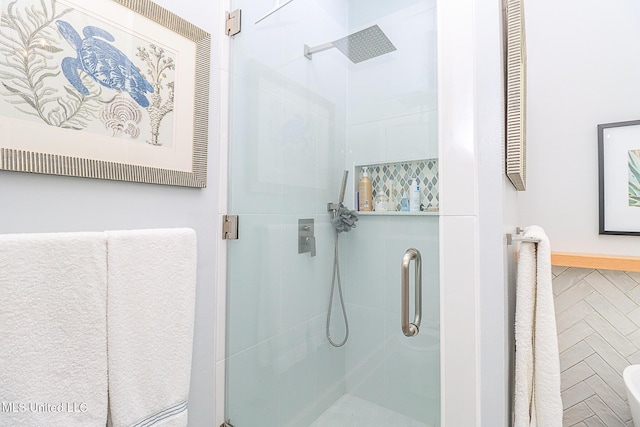 bathroom featuring a shower stall