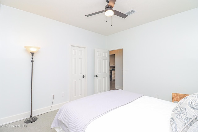 bedroom featuring baseboards, carpet flooring, and a ceiling fan