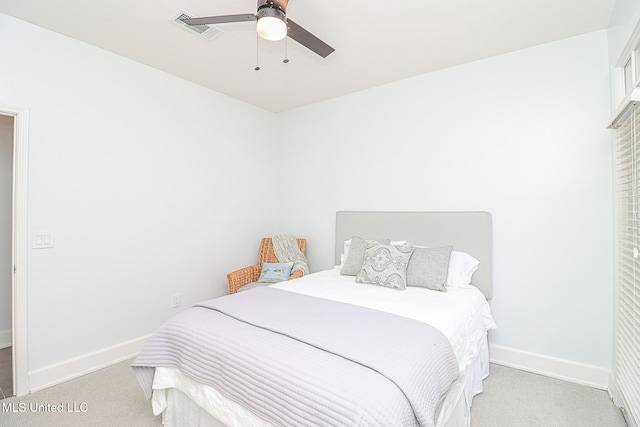bedroom featuring light colored carpet, baseboards, and ceiling fan