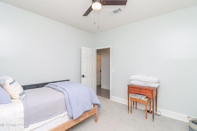 bedroom featuring baseboards, ceiling fan, and carpet flooring