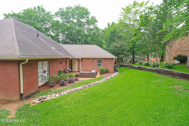 view of green lawn featuring outdoor lounge area and a patio area