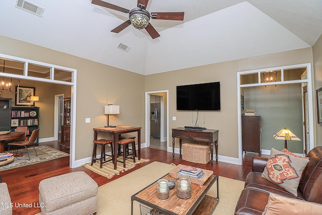 living room featuring ceiling fan, wood finished floors, a desk, lofted ceiling, and baseboards