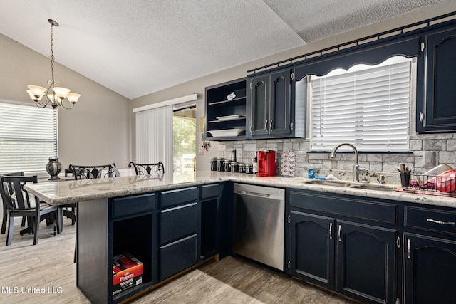 kitchen featuring open shelves, vaulted ceiling, dishwasher, a sink, and a peninsula