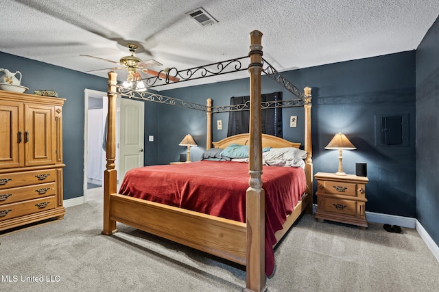 bedroom with visible vents, a ceiling fan, baseboards, and light colored carpet
