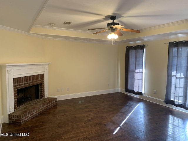 unfurnished living room with ornamental molding, ceiling fan, a fireplace, and dark hardwood / wood-style flooring