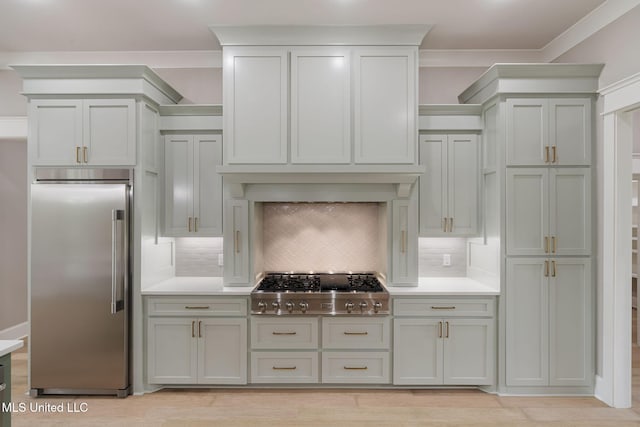 9 Sanctuary Ln, Sumrall, MS 39482 - kitchen featuring crown molding, appliances with stainless steel finishes, decorative backsplash, and light countertops