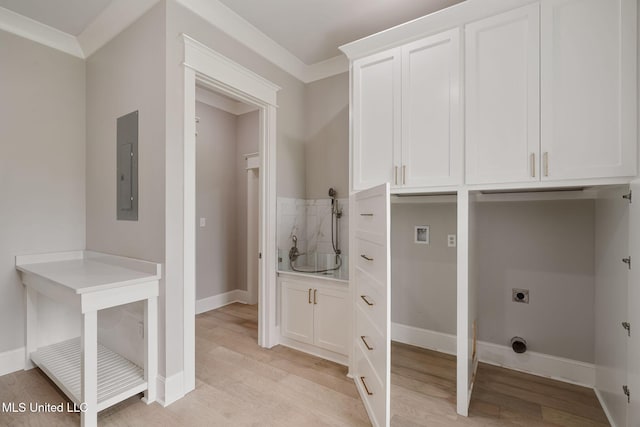 9 Sanctuary Ln, Sumrall, MS 39482 - washroom featuring hookup for an electric dryer, electric panel, cabinet space, baseboards, and light wood-style flooring