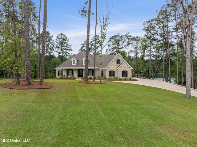 9 Sanctuary Ln, Sumrall, MS 39482 - view of front facade featuring concrete driveway and a front lawn