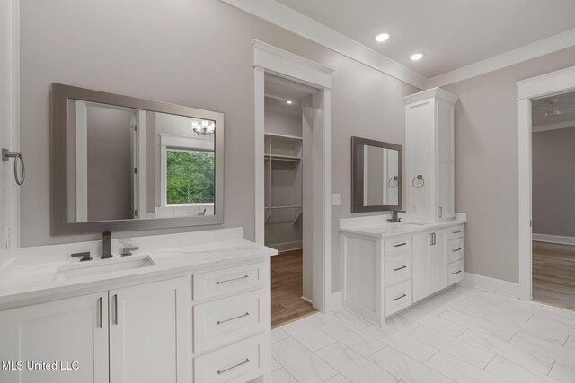 9 Sanctuary Ln, Sumrall, MS 39482 - bathroom with baseboards, a sink, marble finish floor, and two vanities
