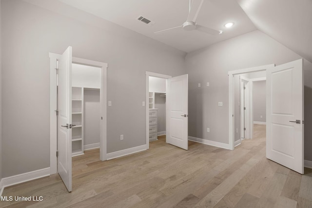 9 Sanctuary Ln, Sumrall, MS 39482 - unfurnished bedroom featuring a walk in closet, light wood finished floors, a ceiling fan, baseboards, and visible vents