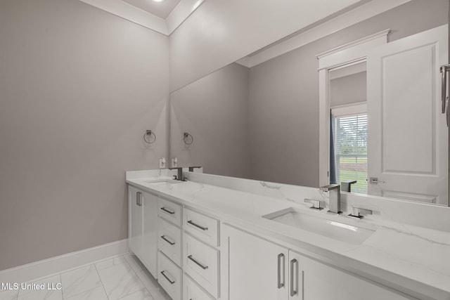 9 Sanctuary Ln, Sumrall, MS 39482 - bathroom with double vanity, a sink, marble finish floor, and baseboards