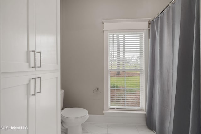 9 Sanctuary Ln, Sumrall, MS 39482 - full bath featuring baseboards, toilet, and a shower with shower curtain