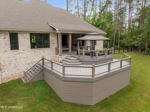 9 Sanctuary Ln, Sumrall, MS 39482 - rear view of house featuring a deck, stairway, brick siding, a gazebo, and a yard