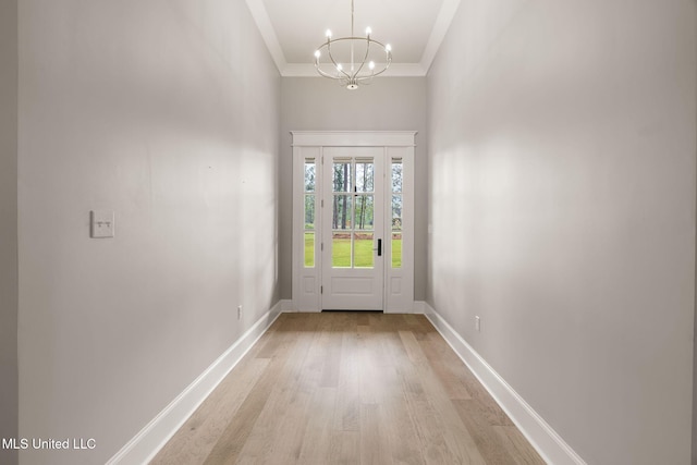 9 Sanctuary Ln, Sumrall, MS 39482 - entryway featuring crown molding, a high ceiling, an inviting chandelier, light wood finished floors, and baseboards
