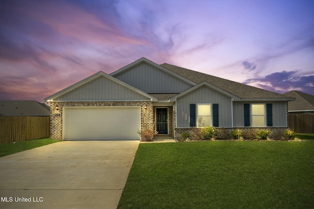 craftsman inspired home featuring a yard and a garage