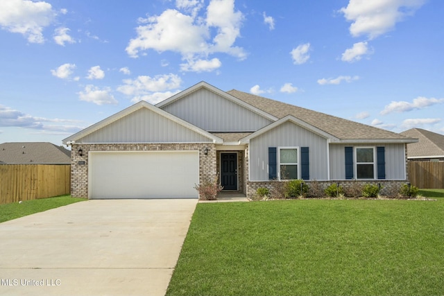 view of front of house with a front lawn and a garage