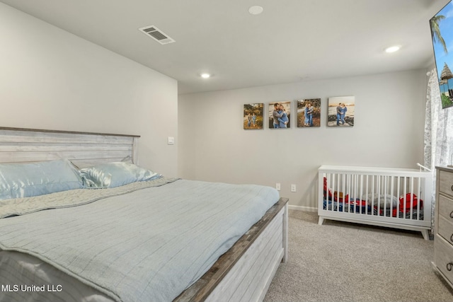 bedroom with light colored carpet