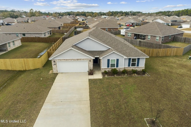 view of front facade with a garage and a front lawn