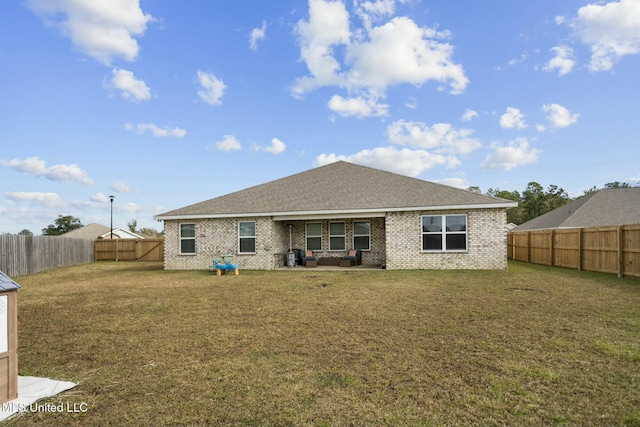 back of house with outdoor lounge area and a lawn