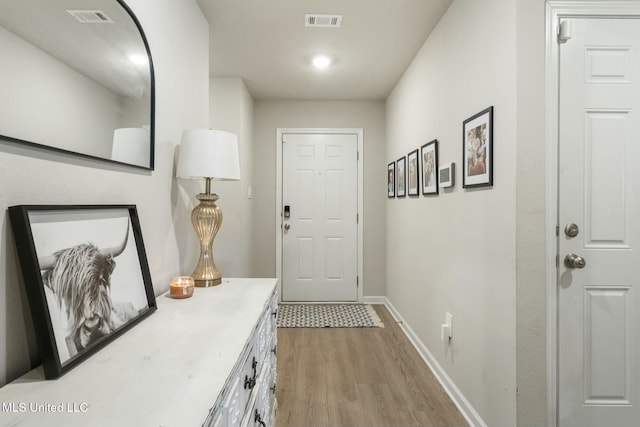 doorway to outside featuring light wood-type flooring