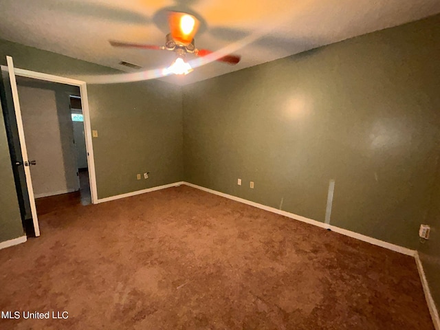 unfurnished bedroom featuring carpet and ceiling fan