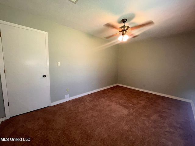 carpeted empty room featuring ceiling fan