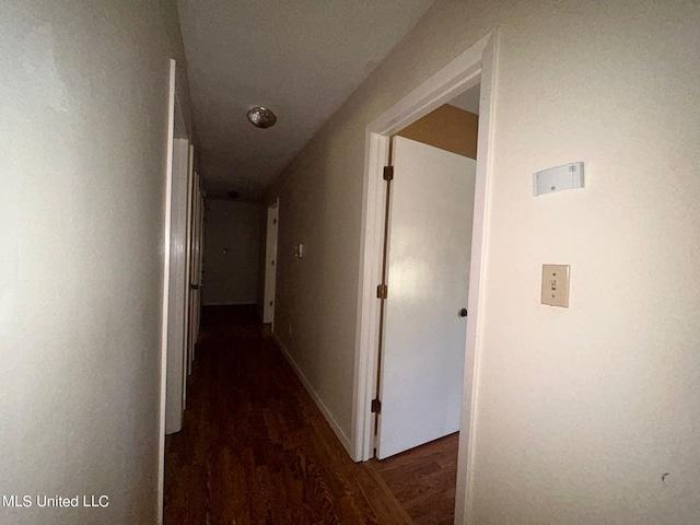 corridor featuring dark hardwood / wood-style flooring