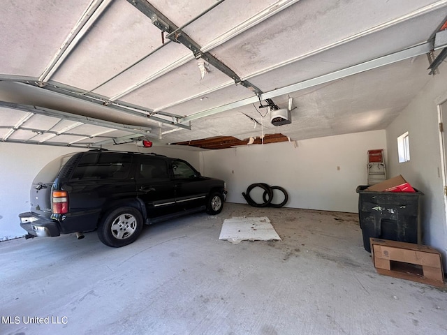 garage featuring a garage door opener