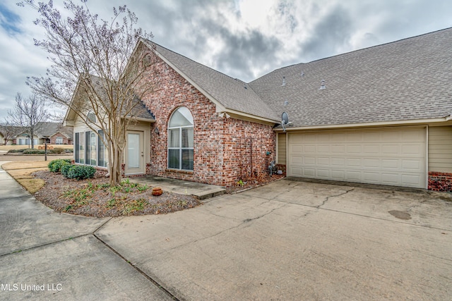 view of side of property with a garage