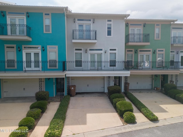 25 Oak Alley Ln Unit 25, Long Beach, MS 39560 - multi unit property featuring an attached garage, stucco siding, and french doors
