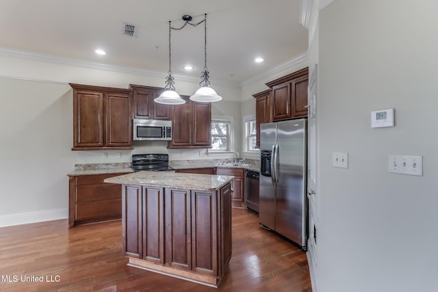 25 Oak Alley Ln Unit 25, Long Beach, MS 39560 - kitchen with appliances with stainless steel finishes, ornamental molding, a center island, dark wood-style flooring, and pendant lighting