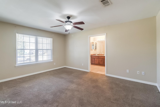 carpeted empty room with ceiling fan