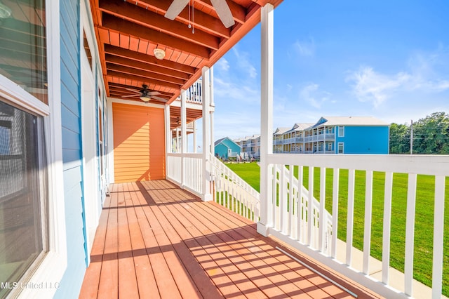 1515 E Beach Blvd Unit 114, Pass Christian, MS 39571 - wooden terrace featuring a ceiling fan, a yard, and a residential view