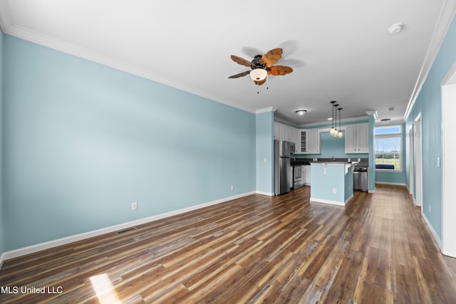 1515 E Beach Blvd Unit 114, Pass Christian, MS 39571 - unfurnished living room with ornamental molding, ceiling fan, dark wood-type flooring, and baseboards
